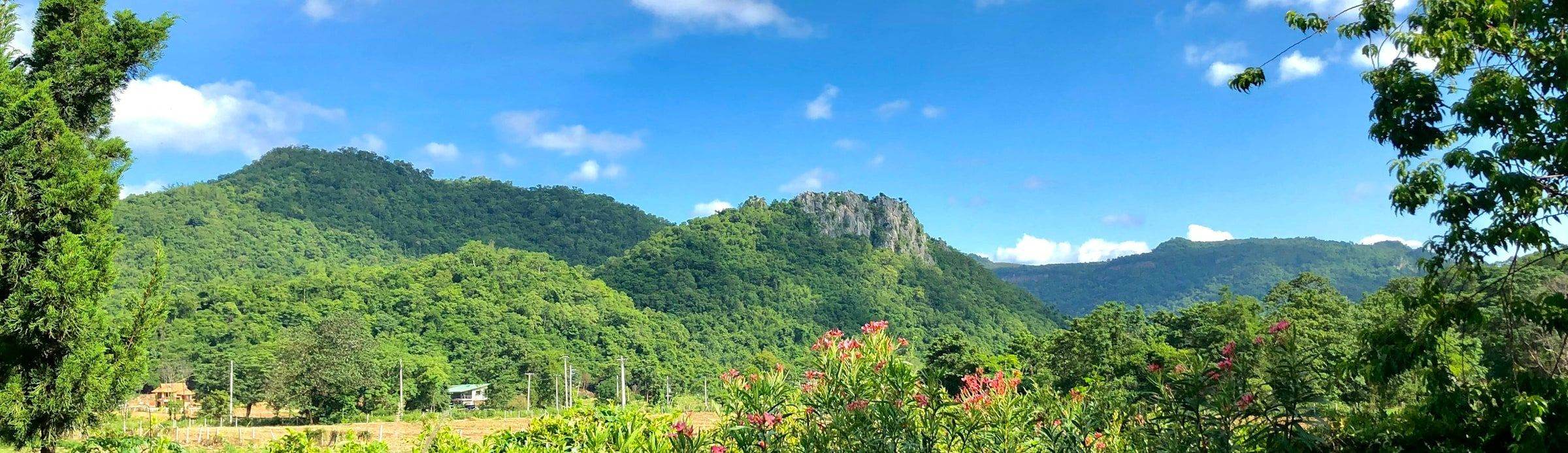 Forested hills under open sky, the uplands inland from Pak Chong